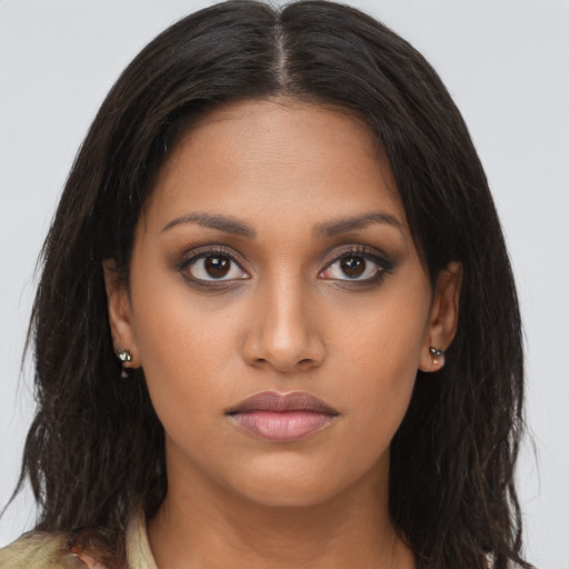 Neutral black young-adult female with long  brown hair and brown eyes