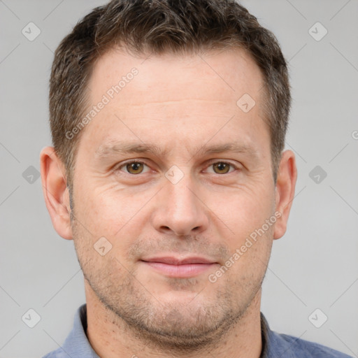 Joyful white adult male with short  brown hair and brown eyes