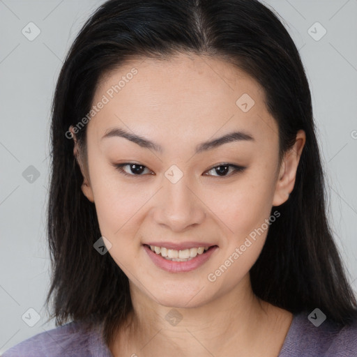 Joyful asian young-adult female with long  brown hair and brown eyes