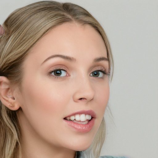 Joyful white young-adult female with long  brown hair and blue eyes