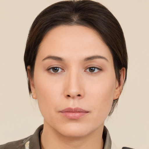 Neutral white young-adult female with medium  brown hair and brown eyes