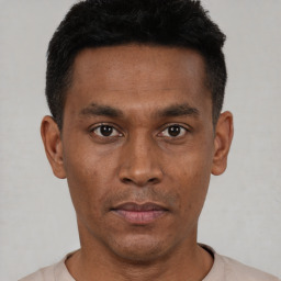 Neutral black young-adult male with short  black hair and brown eyes