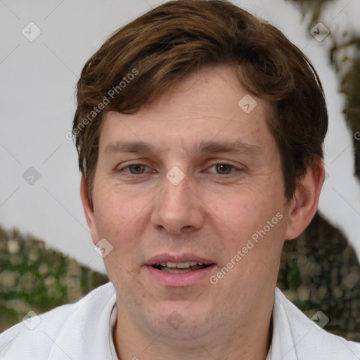 Joyful white adult male with short  brown hair and grey eyes