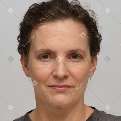 Joyful white adult female with short  brown hair and brown eyes