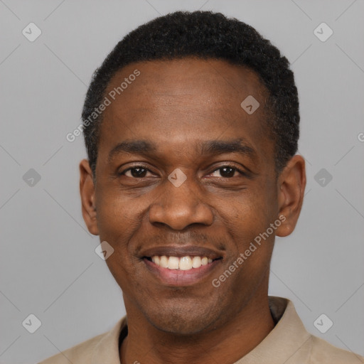 Joyful black young-adult male with short  black hair and brown eyes