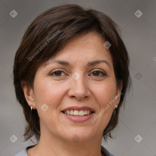 Joyful white adult female with medium  brown hair and brown eyes