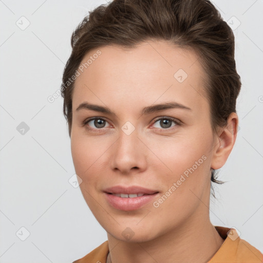 Joyful white young-adult female with short  brown hair and brown eyes