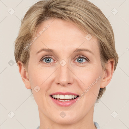 Joyful white adult female with short  brown hair and grey eyes