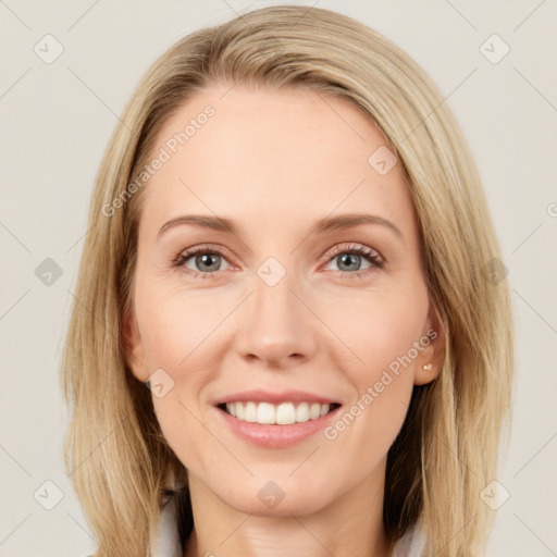 Joyful white young-adult female with long  brown hair and blue eyes