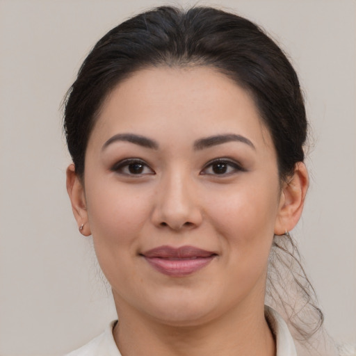 Joyful asian young-adult female with medium  brown hair and brown eyes