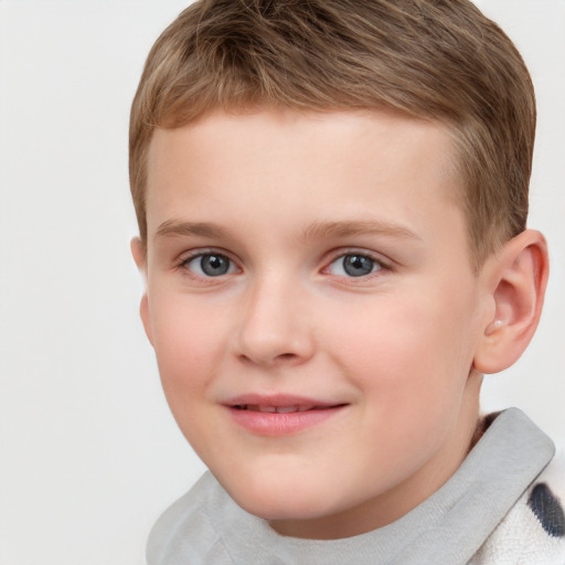 Joyful white child male with short  brown hair and grey eyes