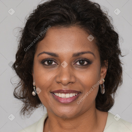 Joyful black adult female with medium  brown hair and brown eyes