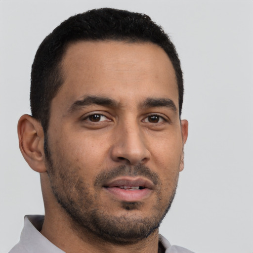 Neutral latino young-adult male with short  black hair and brown eyes