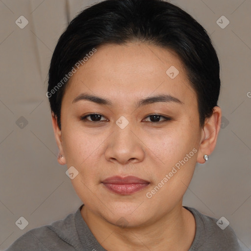 Joyful asian young-adult female with short  brown hair and brown eyes