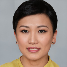 Joyful asian young-adult female with short  brown hair and brown eyes