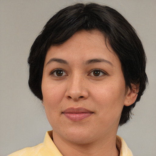 Joyful white adult female with medium  brown hair and brown eyes