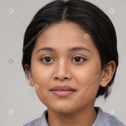 Joyful latino young-adult female with medium  brown hair and brown eyes