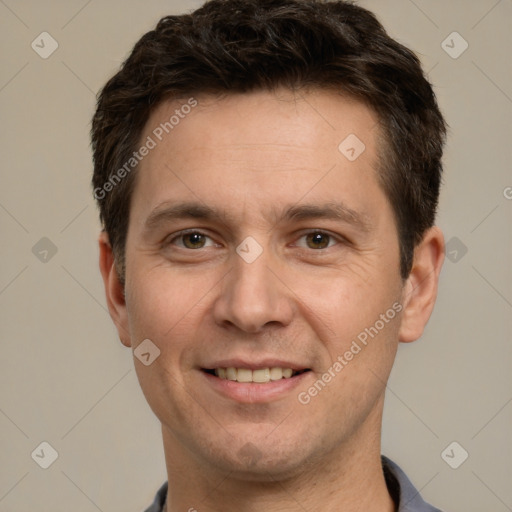 Joyful white adult male with short  brown hair and brown eyes