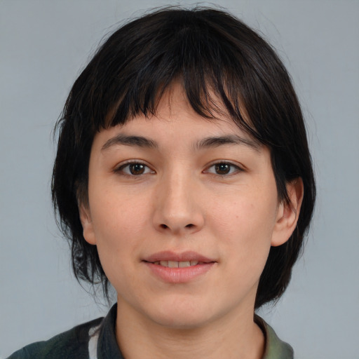 Joyful white young-adult female with medium  black hair and brown eyes