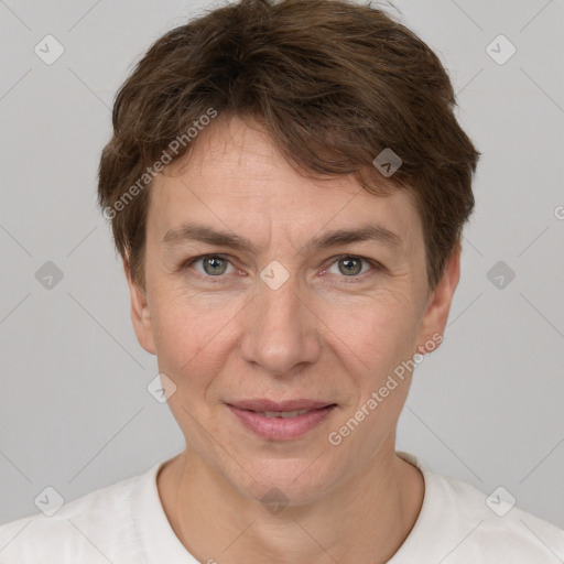 Joyful white adult female with short  brown hair and grey eyes