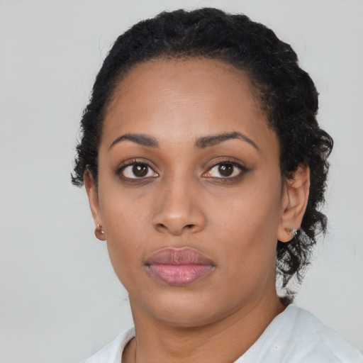 Neutral black young-adult female with short  black hair and brown eyes