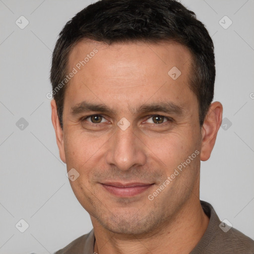 Joyful white adult male with short  brown hair and brown eyes