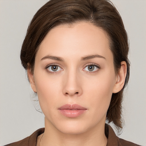 Neutral white young-adult female with medium  brown hair and brown eyes