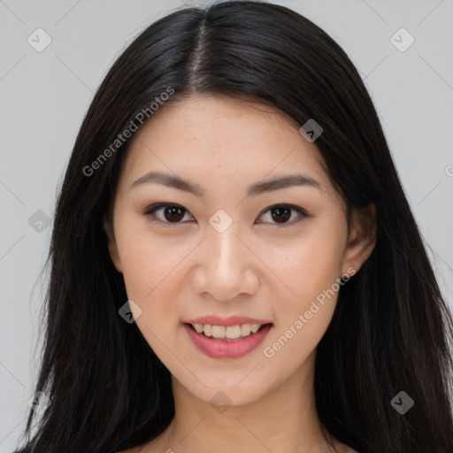 Joyful asian young-adult female with long  brown hair and brown eyes