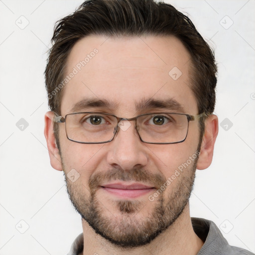 Joyful white adult male with short  brown hair and grey eyes