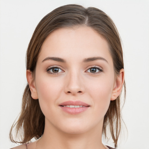 Joyful white young-adult female with long  brown hair and grey eyes