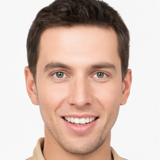 Joyful white young-adult male with short  brown hair and brown eyes