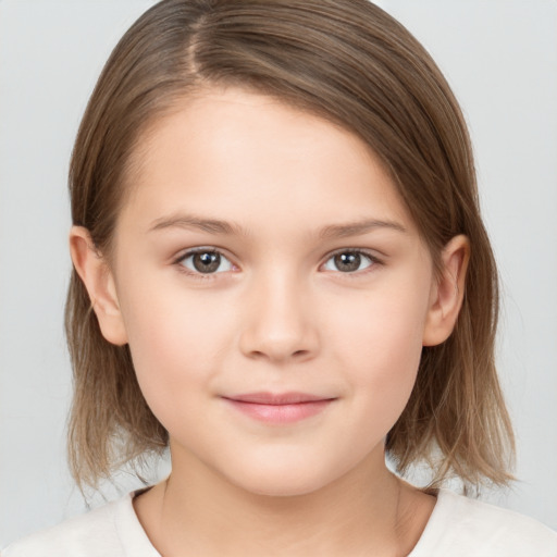 Joyful white child female with medium  brown hair and brown eyes