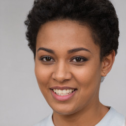 Joyful latino young-adult female with short  brown hair and brown eyes