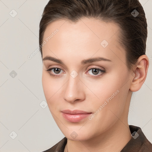 Neutral white young-adult female with long  brown hair and brown eyes