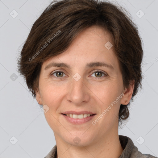 Joyful white adult female with medium  brown hair and grey eyes