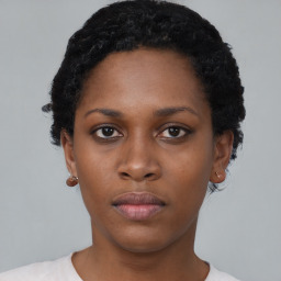 Neutral black young-adult female with short  black hair and brown eyes