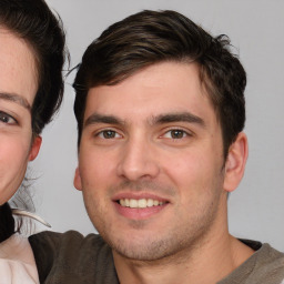 Joyful white young-adult male with medium  brown hair and brown eyes