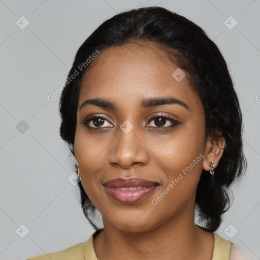 Joyful black young-adult female with medium  black hair and brown eyes