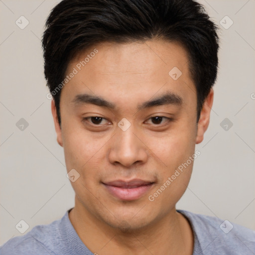 Joyful asian young-adult male with short  brown hair and brown eyes