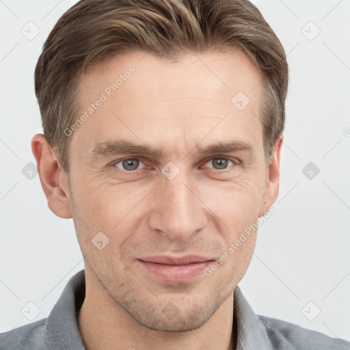 Joyful white adult male with short  brown hair and grey eyes