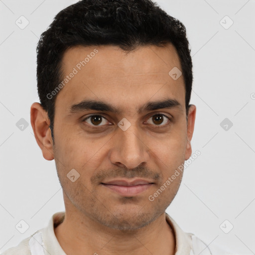 Joyful latino young-adult male with short  brown hair and brown eyes