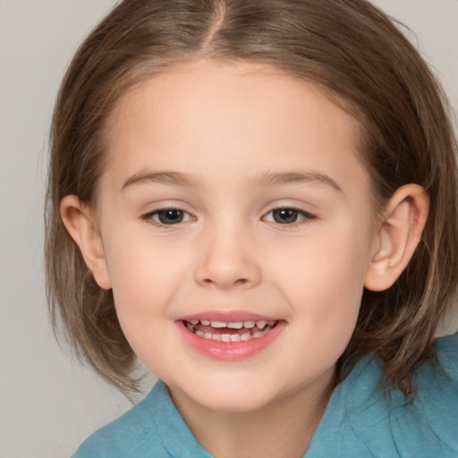 Joyful white child female with medium  brown hair and brown eyes