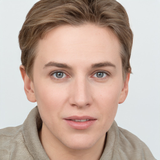 Joyful white young-adult female with short  brown hair and grey eyes