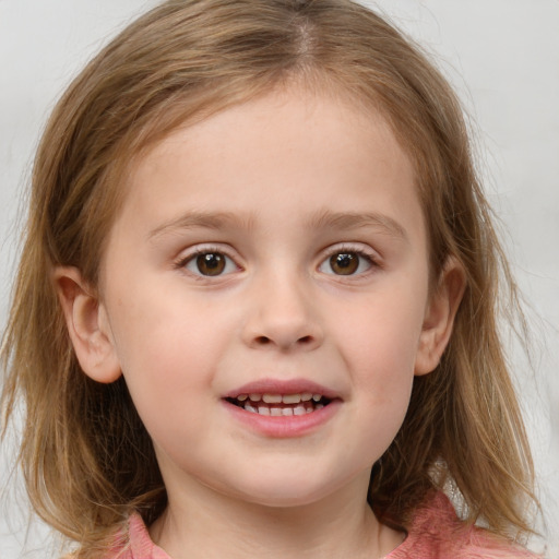 Joyful white child female with medium  brown hair and blue eyes