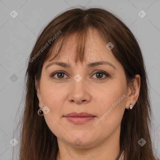 Joyful white adult female with long  brown hair and brown eyes