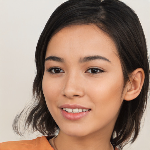 Joyful white young-adult female with medium  black hair and brown eyes