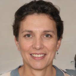 Joyful white adult female with short  brown hair and brown eyes