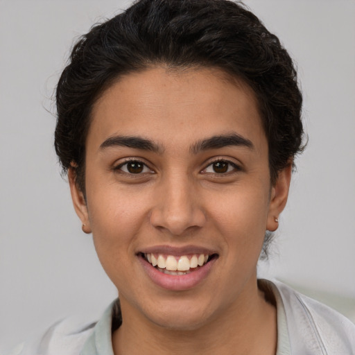Joyful white young-adult female with short  brown hair and brown eyes