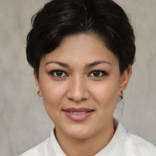 Joyful asian young-adult female with short  brown hair and brown eyes