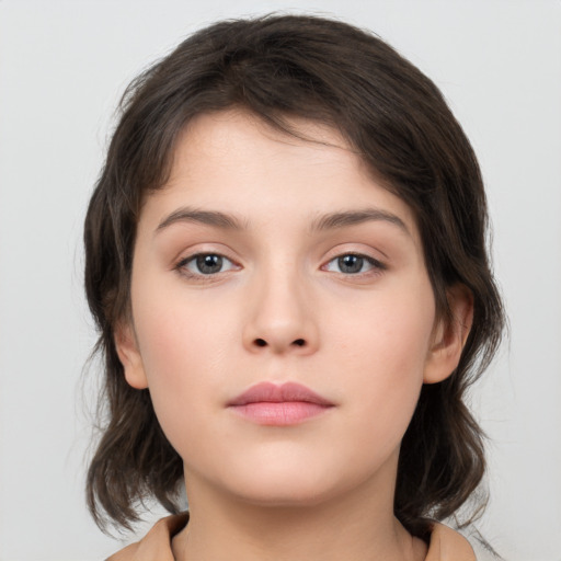 Neutral white young-adult female with medium  brown hair and brown eyes